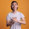 young-cheerful-smiling-asian-man-applauding-2025-02-19-01-34-50-utc-scaled.jpg